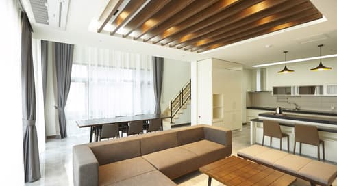 An opulent presidential suite with a separate living area, lavish decorations, and city views.